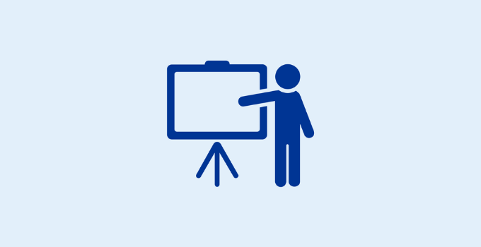 Blue outline of person in front of chalkboard